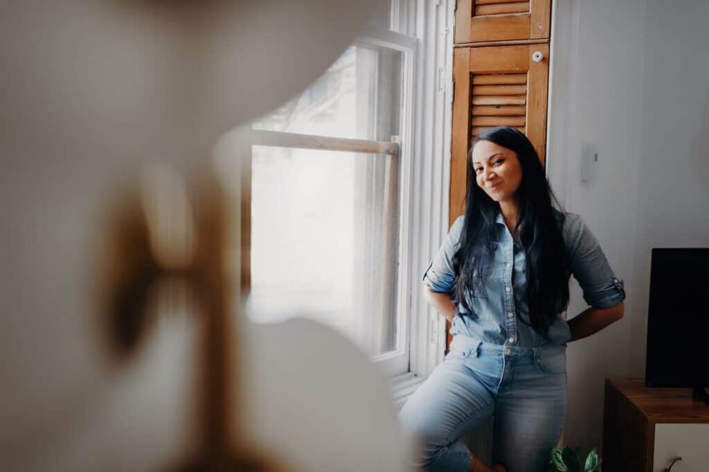 woman standing by window